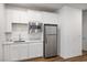Cozy kitchenette featuring white cabinetry, stainless steel appliances, and a practical design at 3909 Grazing Gazelle Ave, North Las Vegas, NV 89084