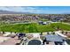 A community aerial view features a large green space with a playground, complemented by mountain views at 4125 Venus Falls Ave, North Las Vegas, NV 89084