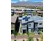 A neighborhood aerial view showcasing modern homes with desert landscaping, complemented by mountain views at 4125 Venus Falls Ave, North Las Vegas, NV 89084