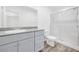 Well-lit bathroom with vanity and granite countertop, and a glass-enclosed shower at 4125 Venus Falls Ave, North Las Vegas, NV 89084