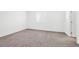 Bright bedroom features carpet flooring, a window, and a closet for ample storage at 4125 Venus Falls Ave, North Las Vegas, NV 89084