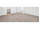 Spacious carpeted bedroom with neutral walls and plenty of natural light from windows at 4125 Venus Falls Ave, North Las Vegas, NV 89084