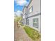 View of the side exterior of the house with small patches of grass at 4125 Venus Falls Ave, North Las Vegas, NV 89084