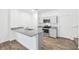 Modern kitchen with granite countertops and stainless steel appliances at 4125 Venus Falls Ave, North Las Vegas, NV 89084