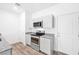 Stylish kitchen boasting stainless steel appliances and light gray cabinetry at 4125 Venus Falls Ave, North Las Vegas, NV 89084