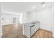Open-concept living space seamlessly connecting to the kitchen and featuring wood flooring at 4125 Venus Falls Ave, North Las Vegas, NV 89084