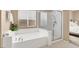Bathroom featuring a bathtub, separate shower, and a window that provides natural light at 4443 Verdiccio Ave, Las Vegas, NV 89141