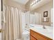 Well-lit bathroom with shower-tub combination and a single sink vanity at 4443 Verdiccio Ave, Las Vegas, NV 89141