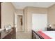 Bedroom features neutral walls and carpet, closet, dresser and hall access at 4443 Verdiccio Ave, Las Vegas, NV 89141