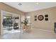 Bright dining area with sliding glass doors to the patio, ideal for indoor-outdoor dining at 4443 Verdiccio Ave, Las Vegas, NV 89141