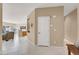 Spacious hallway leading into an open-concept living area, with tile flooring and neutral wall colors at 4443 Verdiccio Ave, Las Vegas, NV 89141