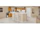 Bright kitchen featuring white countertops, stainless appliances, and a convenient breakfast bar with seating at 4443 Verdiccio Ave, Las Vegas, NV 89141