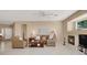 Comfortable living room with a cozy fireplace and natural light, perfect for relaxation and gatherings at 4443 Verdiccio Ave, Las Vegas, NV 89141
