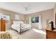 Serene main bedroom with neutral tones, natural light, and ceiling fan at 4443 Verdiccio Ave, Las Vegas, NV 89141