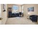 Office space with lots of light, black furniture and dark cabinets at 4443 Verdiccio Ave, Las Vegas, NV 89141
