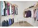 Walk-in closet with ample shelving and hanging space for clothes and accessories at 4443 Verdiccio Ave, Las Vegas, NV 89141