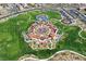 Expansive aerial view highlighting the playground and manicured green space within the community at 502 Sonoma Range St, Las Vegas, NV 89138