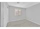 Bedroom with gray walls and carpet and a window with blinds and a closet with door at 502 Sonoma Range St, Las Vegas, NV 89138
