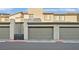 Contemporary townhome with a large two-car garage, neutral color palette, and clean architectural lines at 502 Sonoma Range St, Las Vegas, NV 89138