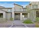 Modern townhome with a desert landscape, neutral paint scheme and pavers to the front door at 502 Sonoma Range St, Las Vegas, NV 89138
