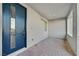 Charming front porch featuring a stylish blue front door and neutral brick flooring at 502 Sonoma Range St, Las Vegas, NV 89138