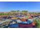 Vibrant playground with colorful structures, palm trees, and covered picnic areas, perfect for Gathering fun at 502 Sonoma Range St, Las Vegas, NV 89138