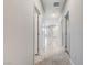 Hallway with tile floors, leading to main entrance, connecting the home's interior spaces at 534 Lassen Falls Ct, Henderson, NV 89044