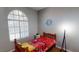 Bedroom boasting a large window, wood frame bed, and unique decor at 5517 Rose Thicket St, Las Vegas, NV 89130