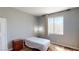 Bedroom features window, curtains, neutral colored walls, light fixture and carpet at 5517 Rose Thicket St, Las Vegas, NV 89130