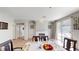 Bright dining room with modern lighting and a cozy fireplace, perfect for Gathering meals at 5517 Rose Thicket St, Las Vegas, NV 89130