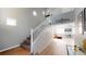 Open staircase with wood flooring leading to a second-floor landing, showcasing the home's modern design at 5517 Rose Thicket St, Las Vegas, NV 89130