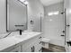 Bathroom featuring a modern vanity with black hardware, toilet and shower/tub combo at 5601 Mary Lou St, Pahrump, NV 89061