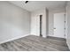 This bedroom offers wood-look floors and a closet with sliding doors at 5601 Mary Lou St, Pahrump, NV 89061