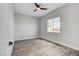 Bedroom with a window to let in natural light and ceiling fan at 5601 Mary Lou St, Pahrump, NV 89061