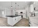 Gourmet kitchen featuring a large island with a dark countertop and modern pendant lighting at 5601 Mary Lou St, Pahrump, NV 89061
