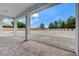 This covered patio offers room for outdoor gatherings and a view of the yard at 5601 Mary Lou St, Pahrump, NV 89061