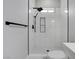 Modern shower with white subway tile, black fixtures, and a built-in niche at 5601 Mary Lou St, Pahrump, NV 89061