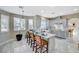 Bright, modern kitchen featuring an island with seating and stainless appliances at 5824 Farmhouse Ct, Las Vegas, NV 89141