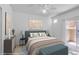 Stylishly staged bedroom with contemporary decor and a ceiling fan at 5855 Valley Dr # 2020, North Las Vegas, NV 89031