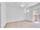 Empty bedroom featuring carpet flooring, a ceiling fan and balcony access at 5855 Valley Dr # 2020, North Las Vegas, NV 89031