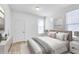 Bright bedroom featuring neutral decor, carpet flooring, and ample natural light at 5855 Valley Dr # 2020, North Las Vegas, NV 89031