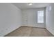Empty bedroom featuring carpet flooring, and ample natural light at 5855 Valley Dr # 2020, North Las Vegas, NV 89031
