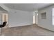 Bright and airy living room with access to the entryway and a large window at 5855 Valley Dr # 2020, North Las Vegas, NV 89031
