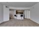 Open-concept living space with bar seating and a view into the kitchen at 5855 Valley Dr # 2020, North Las Vegas, NV 89031