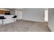 Open layout between the living area and kitchen with bar stools at 5855 Valley Dr # 2020, North Las Vegas, NV 89031