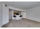 Spacious living room featuring bar seating and view to the kitchen at 5855 Valley Dr # 2020, North Las Vegas, NV 89031