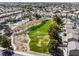 Aerial view of a green space featuring mature trees, walking path, and nearby neighborhood at 6120 Crystal Cascade St, Las Vegas, NV 89130