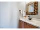 The half bath features a modern mirror, elegant fixtures, and a pristine white countertop at 6120 Crystal Cascade St, Las Vegas, NV 89130