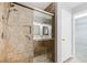 Tiled shower with glass door and built in seat next to double sinks and linen closet at 6120 Crystal Cascade St, Las Vegas, NV 89130