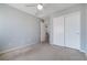 This bedroom includes a ceiling fan and closet, offering practical and comfortable living space at 6120 Crystal Cascade St, Las Vegas, NV 89130